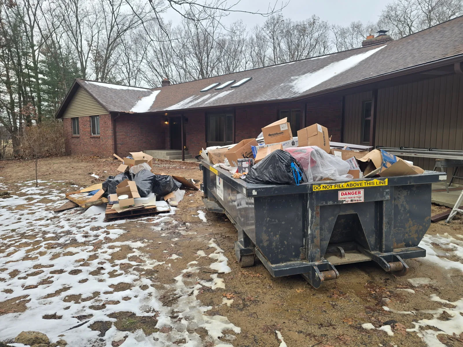 The same dumpster loaded and ready to be hauled away